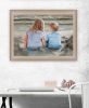 "Boy and Girl Sitting in Dunes" by Artisan Georgia Janisse, Ready to Hang Framed Print, Brown Frame